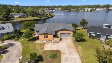 Experience unparalleled waterfront living in this waterfront on Harbour Point Golf Club in North Carolina - for sale on GolfHomes.com, golf home, golf lot