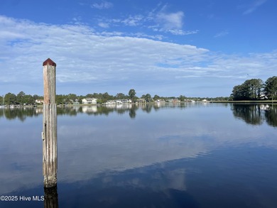 Experience unparalleled waterfront living in this waterfront on Harbour Point Golf Club in North Carolina - for sale on GolfHomes.com, golf home, golf lot