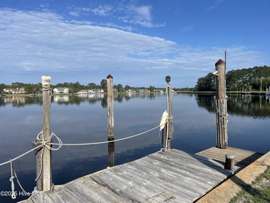 Experience unparalleled waterfront living in this waterfront on Harbour Point Golf Club in North Carolina - for sale on GolfHomes.com, golf home, golf lot