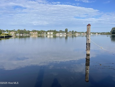 Experience unparalleled waterfront living in this waterfront on Harbour Point Golf Club in North Carolina - for sale on GolfHomes.com, golf home, golf lot