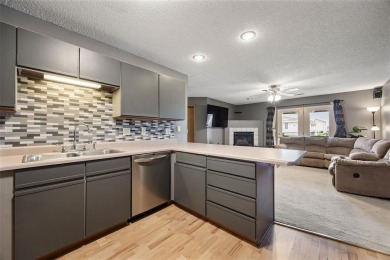 Enjoy top-floor privacy and peaceful views from this pristine on Quail Creek Golf Course in Iowa - for sale on GolfHomes.com, golf home, golf lot
