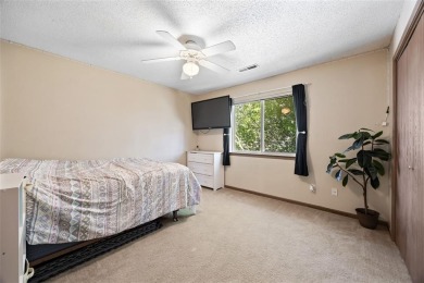 Enjoy top-floor privacy and peaceful views from this pristine on Quail Creek Golf Course in Iowa - for sale on GolfHomes.com, golf home, golf lot