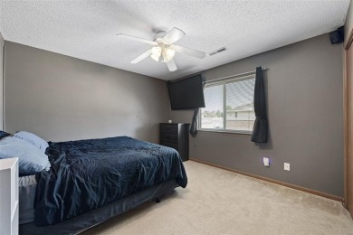 Enjoy top-floor privacy and peaceful views from this pristine on Quail Creek Golf Course in Iowa - for sale on GolfHomes.com, golf home, golf lot