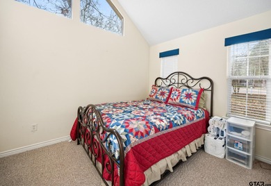 Tucked away on a beautifully wooded lot in the heart of East on Holly Lake Ranch Golf Club in Texas - for sale on GolfHomes.com, golf home, golf lot