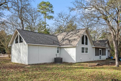 Tucked away on a beautifully wooded lot in the heart of East on Holly Lake Ranch Golf Club in Texas - for sale on GolfHomes.com, golf home, golf lot