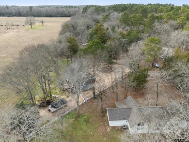 Tucked away on a beautifully wooded lot in the heart of East on Holly Lake Ranch Golf Club in Texas - for sale on GolfHomes.com, golf home, golf lot