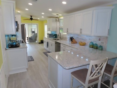 Watch the sunrise or just relax in your glass enclosed 4 season on Crane Lakes Golf and Country Club in Florida - for sale on GolfHomes.com, golf home, golf lot