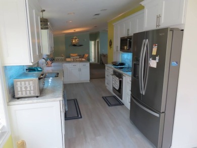 Watch the sunrise or just relax in your glass enclosed 4 season on Crane Lakes Golf and Country Club in Florida - for sale on GolfHomes.com, golf home, golf lot