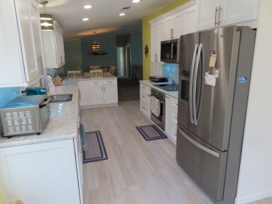 Watch the sunrise or just relax in your glass enclosed 4 season on Crane Lakes Golf and Country Club in Florida - for sale on GolfHomes.com, golf home, golf lot