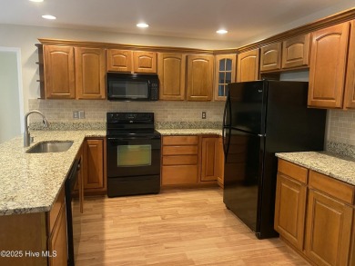 Experience the essence of coastal living in this well maintained on The Country Club of the Crystal Coast in North Carolina - for sale on GolfHomes.com, golf home, golf lot