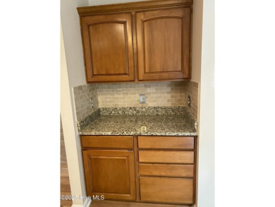 Experience the essence of coastal living in this well maintained on The Country Club of the Crystal Coast in North Carolina - for sale on GolfHomes.com, golf home, golf lot