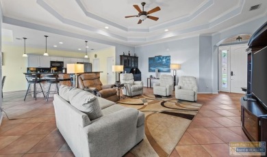 Enjoy lake views and fairway living at 13 Hacienda Dr. This on South Padre Island Golf Club in Texas - for sale on GolfHomes.com, golf home, golf lot