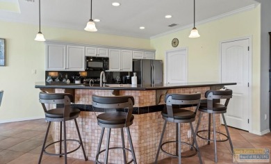 Enjoy lake views and fairway living at 13 Hacienda Dr. This on South Padre Island Golf Club in Texas - for sale on GolfHomes.com, golf home, golf lot