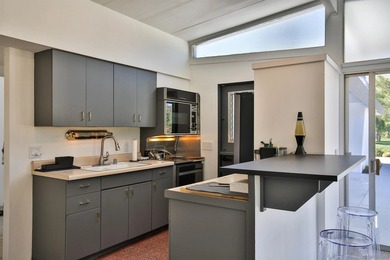 Spectacular Mid-Century Modern home right on the De Anza Golf on Rams Hill Golf Club in California - for sale on GolfHomes.com, golf home, golf lot