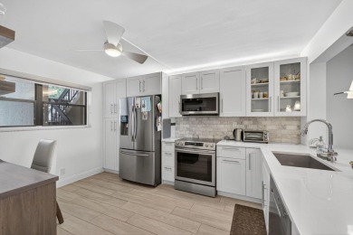 Rare opportunity to  purchase 1st floor, corner unit overlooking on Old Marsh Golf Club in Florida - for sale on GolfHomes.com, golf home, golf lot