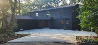 Welcome to this beautifully updated 4-bedroom, 4-bath home on Rumbling Bald Resort on Lake Lure in North Carolina - for sale on GolfHomes.com, golf home, golf lot