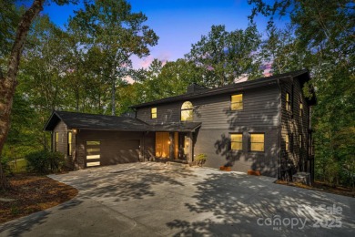 Welcome to this beautifully updated 4-bedroom, 4-bath home on Rumbling Bald Resort on Lake Lure in North Carolina - for sale on GolfHomes.com, golf home, golf lot