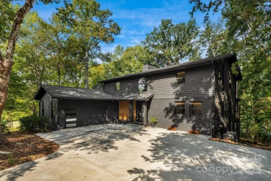 Welcome to this beautifully updated 4-bedroom, 4-bath home on Rumbling Bald Resort on Lake Lure in North Carolina - for sale on GolfHomes.com, golf home, golf lot