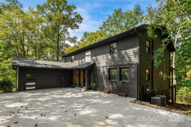 Welcome to this beautifully updated 4-bedroom, 4-bath home on Rumbling Bald Resort on Lake Lure in North Carolina - for sale on GolfHomes.com, golf home, golf lot