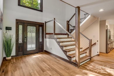 Welcome to this beautifully updated 4-bedroom, 4-bath home on Rumbling Bald Resort on Lake Lure in North Carolina - for sale on GolfHomes.com, golf home, golf lot