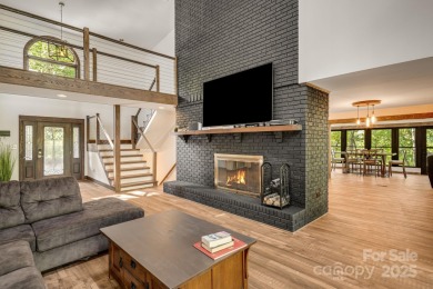 Welcome to this beautifully updated 4-bedroom, 4-bath home on Rumbling Bald Resort on Lake Lure in North Carolina - for sale on GolfHomes.com, golf home, golf lot