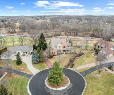 Nestled at the end of a private cul-de-sac, this stunning 4,017 on Stonebridge Golf Club in Michigan - for sale on GolfHomes.com, golf home, golf lot