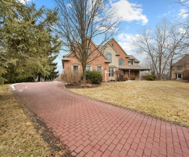 Nestled at the end of a private cul-de-sac, this stunning 4,017 on Stonebridge Golf Club in Michigan - for sale on GolfHomes.com, golf home, golf lot