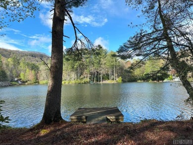 Absolutely magnificent and rare gentle lakefront lot with on Lake Toxaway Country Club in North Carolina - for sale on GolfHomes.com, golf home, golf lot