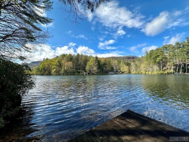 Absolutely magnificent and rare gentle lakefront lot with on Lake Toxaway Country Club in North Carolina - for sale on GolfHomes.com, golf home, golf lot