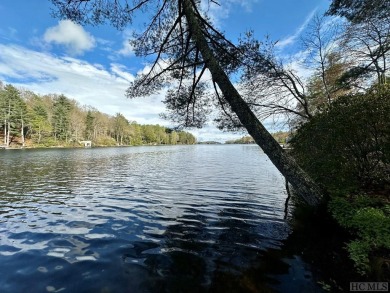 Absolutely magnificent and rare gentle lakefront lot with on Lake Toxaway Country Club in North Carolina - for sale on GolfHomes.com, golf home, golf lot