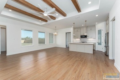 Discover luxury living with this stunning 3 bedroom, 2.5 bath, 1 on South Padre Island Golf Club in Texas - for sale on GolfHomes.com, golf home, golf lot