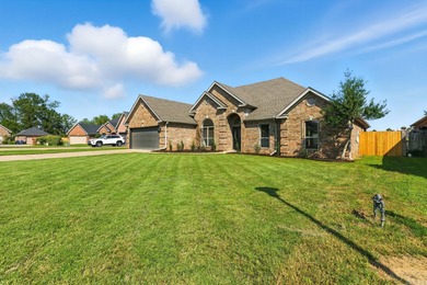 This traditional home located on a quiet street in the Country on The Country Club of Arkansas in Arkansas - for sale on GolfHomes.com, golf home, golf lot