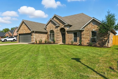 This traditional home located on a quiet street in the Country on The Country Club of Arkansas in Arkansas - for sale on GolfHomes.com, golf home, golf lot