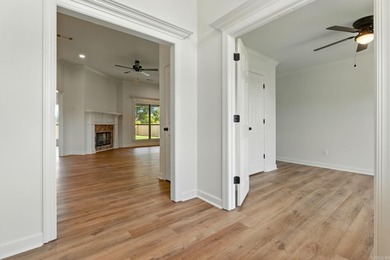 This traditional home located on a quiet street in the Country on The Country Club of Arkansas in Arkansas - for sale on GolfHomes.com, golf home, golf lot