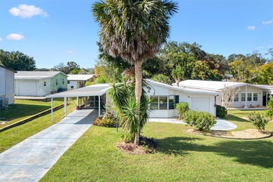 2/2 Manufactured Home with Dual Screened Lanais, Carport and on El Diablo Executive Golf Course in Florida - for sale on GolfHomes.com, golf home, golf lot