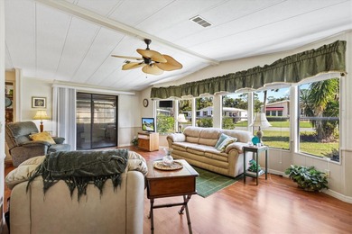 2/2 Manufactured Home with Dual Screened Lanais, Carport and on El Diablo Executive Golf Course in Florida - for sale on GolfHomes.com, golf home, golf lot