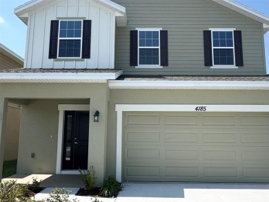 This Stunning Home features 4 bedrooms, 2.5 baths, and a bright on Harmony Golf Preserve in Florida - for sale on GolfHomes.com, golf home, golf lot