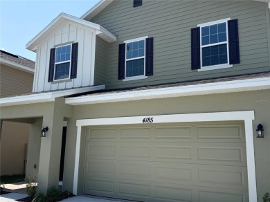This Stunning Home features 4 bedrooms, 2.5 baths, and a bright on Harmony Golf Preserve in Florida - for sale on GolfHomes.com, golf home, golf lot