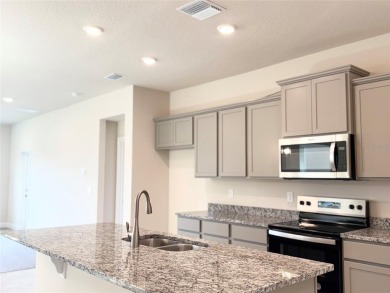 This Stunning Home features 4 bedrooms, 2.5 baths, and a bright on Harmony Golf Preserve in Florida - for sale on GolfHomes.com, golf home, golf lot