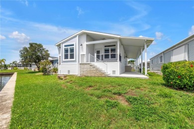 WATERFRONT LIVING | Fully Furnished | 2021 Palm Harbor Home
 on Mangrove Bay Golf Course in Florida - for sale on GolfHomes.com, golf home, golf lot