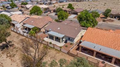 Welcome to this beautifully maintained 1,814 sqft single-story on Desert Lakes Golf Course in Arizona - for sale on GolfHomes.com, golf home, golf lot