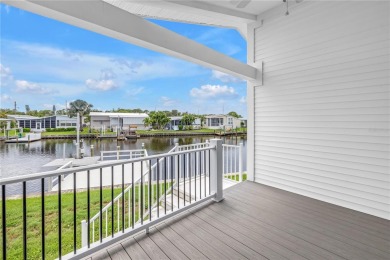 WATERFRONT LIVING | Fully Furnished | 2021 Palm Harbor Home
 on Mangrove Bay Golf Course in Florida - for sale on GolfHomes.com, golf home, golf lot