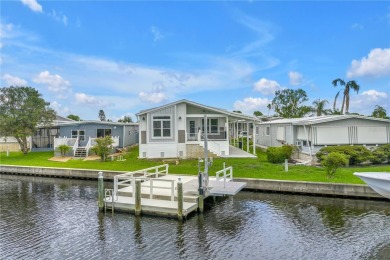 WATERFRONT LIVING | Fully Furnished | 2021 Palm Harbor Home
 on Mangrove Bay Golf Course in Florida - for sale on GolfHomes.com, golf home, golf lot