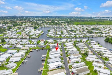 WATERFRONT LIVING | Fully Furnished | 2021 Palm Harbor Home
 on Mangrove Bay Golf Course in Florida - for sale on GolfHomes.com, golf home, golf lot