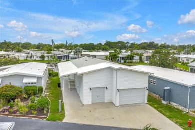 WATERFRONT LIVING | Fully Furnished | 2021 Palm Harbor Home
 on Mangrove Bay Golf Course in Florida - for sale on GolfHomes.com, golf home, golf lot