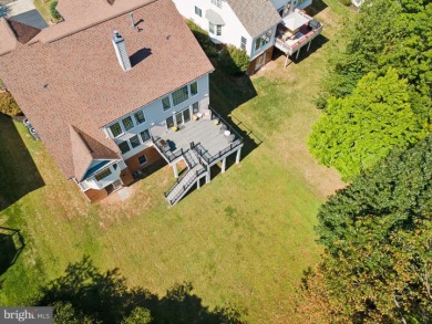 Nestled in a serene cul-de-sac in the sought-after gated on Dominion Valley Country Club in Virginia - for sale on GolfHomes.com, golf home, golf lot