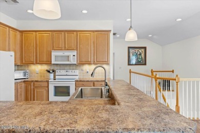 This inviting second-floor condo in the gated community of on Brunswick Plantation and Golf Resorts in North Carolina - for sale on GolfHomes.com, golf home, golf lot