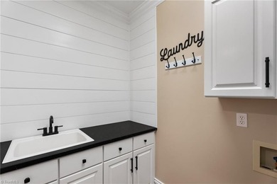 This home lives large! Septic permitted-3BR, but home includes on Sapona Country Club, Inc. in North Carolina - for sale on GolfHomes.com, golf home, golf lot