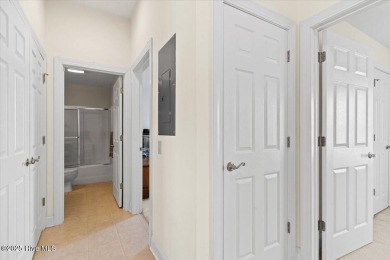 This inviting second-floor condo in the gated community of on Brunswick Plantation and Golf Resorts in North Carolina - for sale on GolfHomes.com, golf home, golf lot