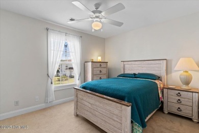 This inviting second-floor condo in the gated community of on Brunswick Plantation and Golf Resorts in North Carolina - for sale on GolfHomes.com, golf home, golf lot